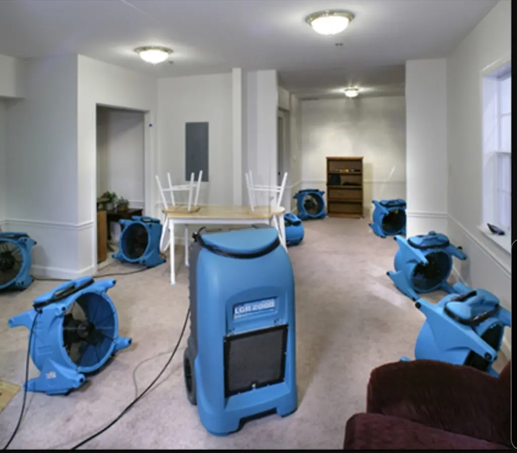 Air movers and dehumidifier setup for Water Damage Restoration in East Milton